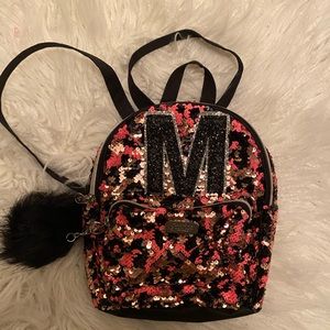 Justice 8 x 10 backpack with initial M on the front.